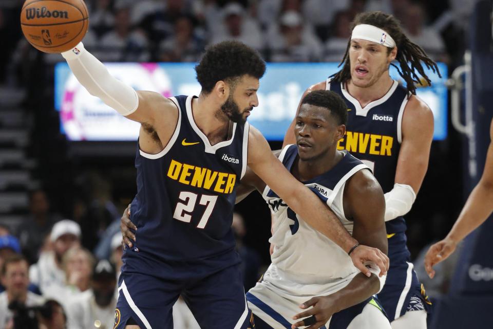 May 12, 2024; Minneapolis, Minnesota, USA; Denver Nuggets guard Jamal Murray (27) works around Minnesota Timberwolves guard Anthony Edwards (5) as forward Aaron Gordon (50) sets a pick in the third quarter of game four of the second round for the 2024 NBA playoffs at Target Center. Mandatory Credit: Bruce Kluckhohn-USA TODAY Sports