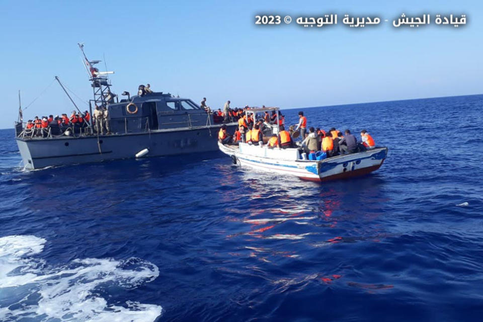 In this photo released by the Lebanese Army official website, a Lebanese army vessel rescues migrants in the Mediterranean Sea, near the shores of Tripoli, north Lebanon, Friday, Oct. 6, 2023. Lebanon's state-run National News Agency says the army has rescued more than 100 migrants after their boat faced technical problems in the Mediterranean Sea. The agency says the boat called for help after it ran into difficulties Friday afternoon in Lebanese territorial waters. (Lebanese Army Website via AP)