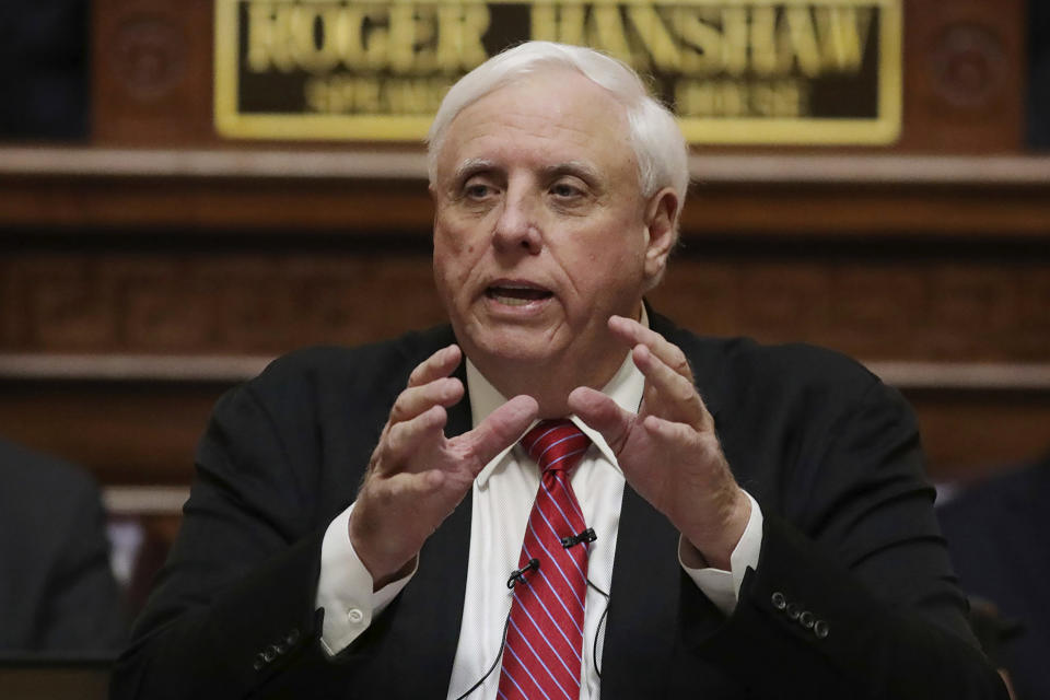 FILE - West Virginia Gov. Jim Justice delivers his annual State of the State address in the House Chambers at the state capitol in Charleston, W.Va., Wednesday, Jan. 8, 2020. Nursing home visits are being allowed again in West Virginia as the state focuses on coronavirus outbreaks in the general populations of individual counties without clamping down on areas without them. Justice warned Monday, Aug. 24, 2020, that the visits could end quickly in some places if further outbreaks occur within nursing homes themselves. (AP Photo/Chris Jackson, File)