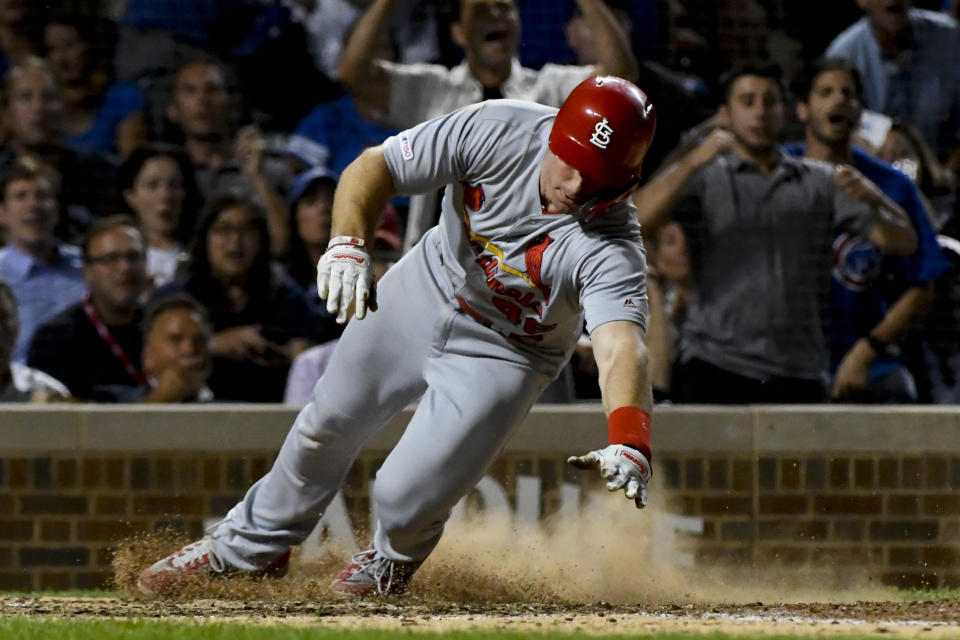 St. Louis Cardinals' Paul Goldschmidt scores during the sixth inning of a baseball game against the Chicago Cubs, Thursday, Sept. 19, 2019, in Chicago. (AP Photo/Matt Marton)