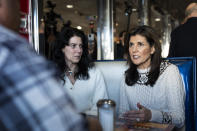Republican presidential candidate former UN Ambassador Nikki Haley, right, meets with patrons during a campaign stop at Mary Ann's Diner in Derry, N.H., Sunday, Jan. 21, 2024. (AP Photo/Matt Rourke)