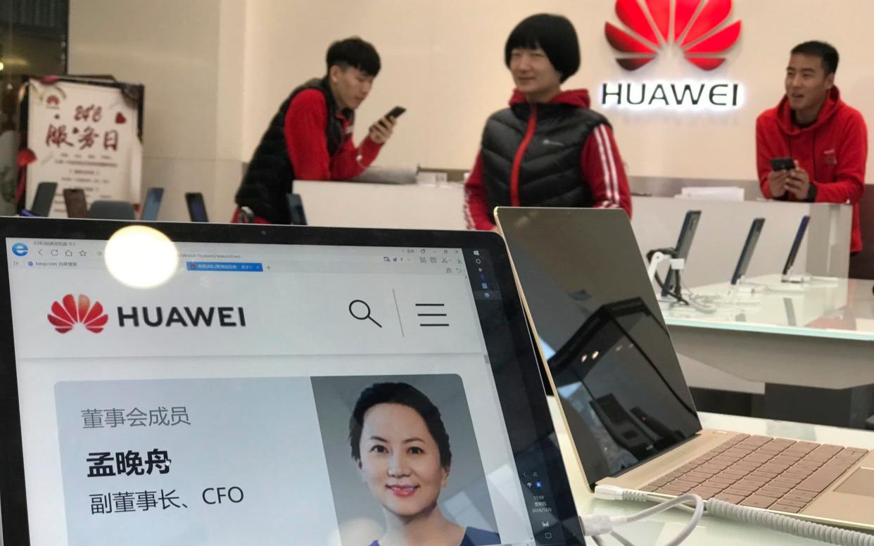 A profile of Huawei's chief financial officer Meng Wanzhou is displayed on a Huawei computer at a Huawei store in Beijing, China - AP