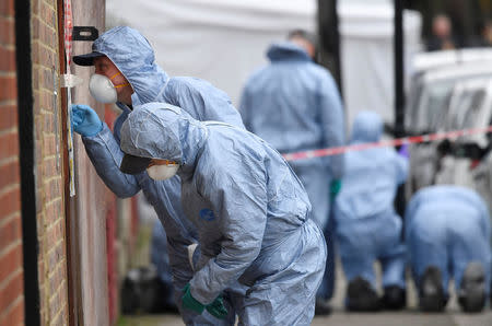 Forensic investigators examine the scene on Chalgrove Road, where a teenage girl was murdered, in Tottenham, Britain, April 3, 2018. REUTERS/Toby Melville