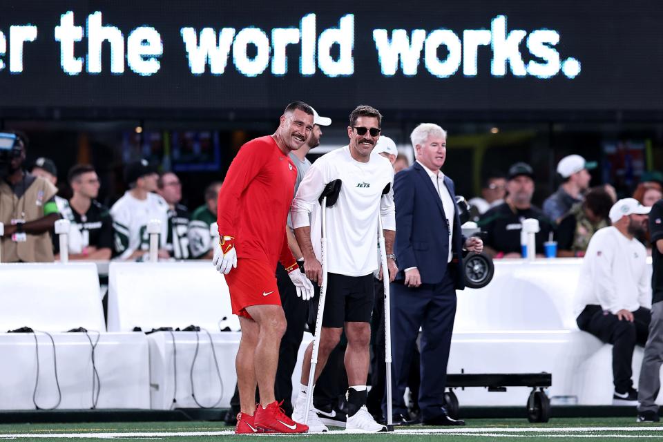 Travis Kelce and Aaron Rodgers were all smiles before their teams squared off on Sunday, Oct. 1. But since then they've been in a war of words over the COVID-19 vaccine.