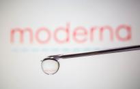 FILE PHOTO: FILE PHOTO: Moderna's logo is reflected in a drop on a syringe needle in this illustration