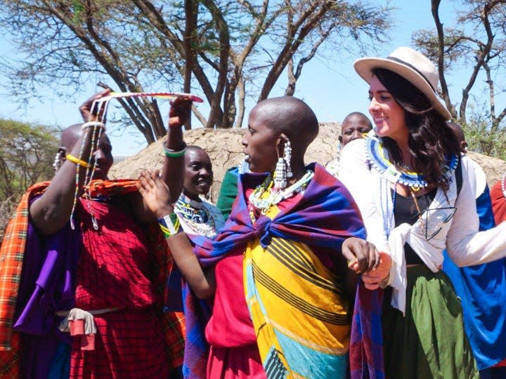 Kate Boardman with locals in Tanzania.