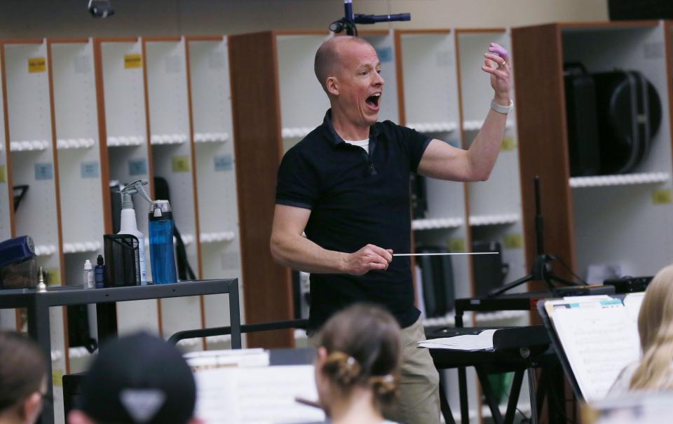 Ames Middle school 8th grade band band teacher conducts during practice for upcoming concert at the school on Wednesday, April 24, 2024, in Ames, Iowa.