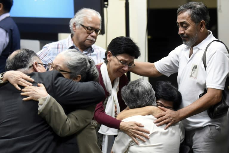Members of the Molina Theissen family hug each other, after hearing court's verdict