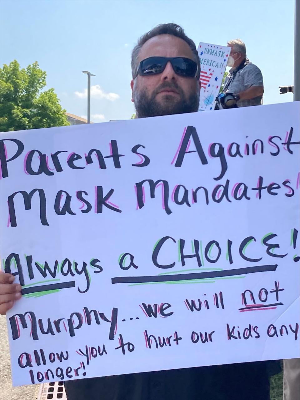 A parent protesting New Jersey Gov. Phil Murphy's announcement Friday of imposing a mask mandate in K-12 schools this fall.