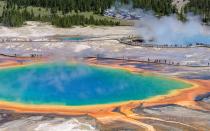 <p>This hot spring in <a rel="nofollow noopener" href="http://www.travelandleisure.com/travel-guide/the-yellowstone-national-park-area" target="_blank" data-ylk="slk:Yellowstone National Park;elm:context_link;itc:0;sec:content-canvas" class="link ">Yellowstone National Park</a> is the deepest in the park. It gets its name from the dark green water it’s filled with, giving it the appearance of a never-ending tunnel into the Earth.</p>