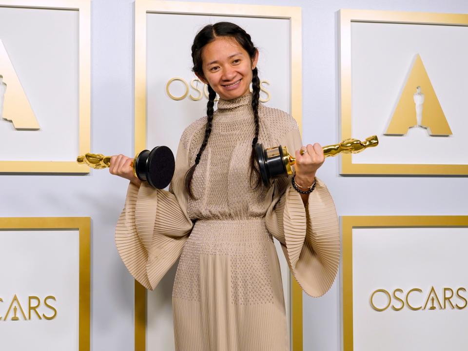 Chloé Zhao holding the Best Director Oscar in 2021.