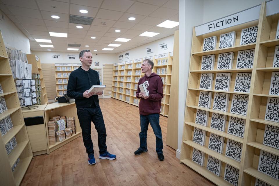 Shrigley in conversation with the manager of the Swansea Oxfam shop where this story began (PA)