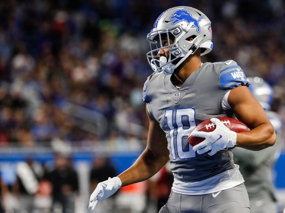 Lions wide receiver KhaDarel Hodge picks up a punt made by punter Jack Fox against the Ravens during the first half of the Lions' 19-17 loss at Ford Field on Sunday, Sept. 26, 2021.