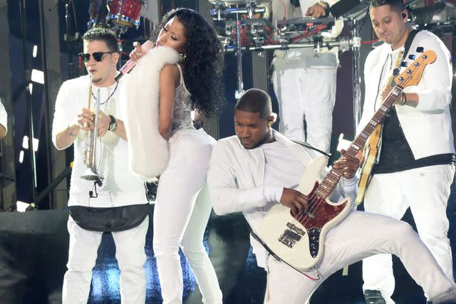 <p>Jeff Kravitz/MTV1415/FilmMagic</p> Nicki Minaj and Usher perform on stage during the 2014 MTV VMAs