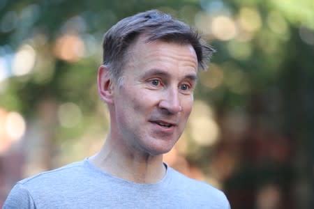 PM hopeful Jeremy Hunt returns after an early morning run in London