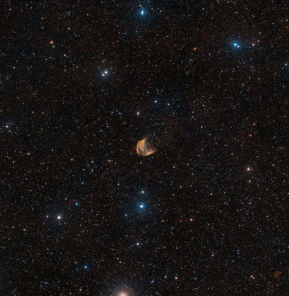 A wide-view of the Medusa Nebula, a large nebula 1,500 light-years from Earth formed by a dying star that is shedding its outer layers. This image was created from astronomy images from the Digitized Sky Survey 2.