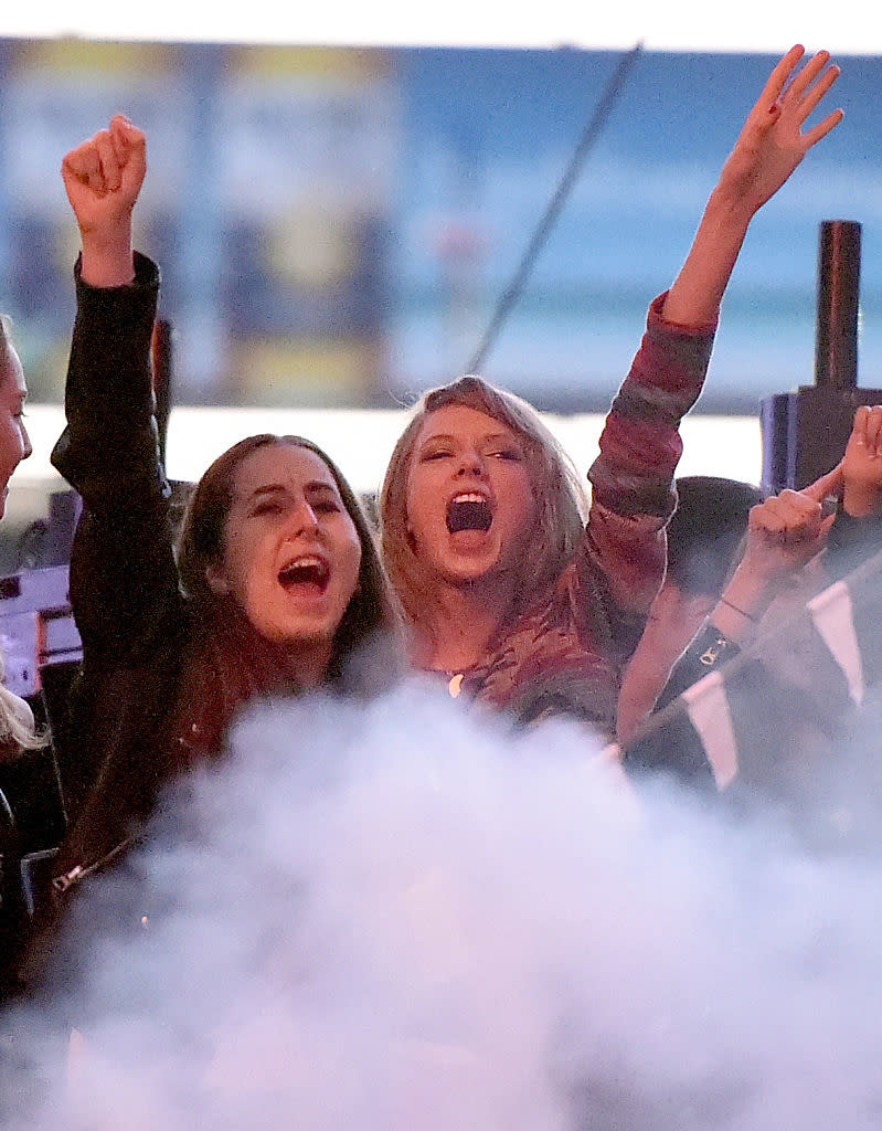 Alana and Taylor singing in a crowd