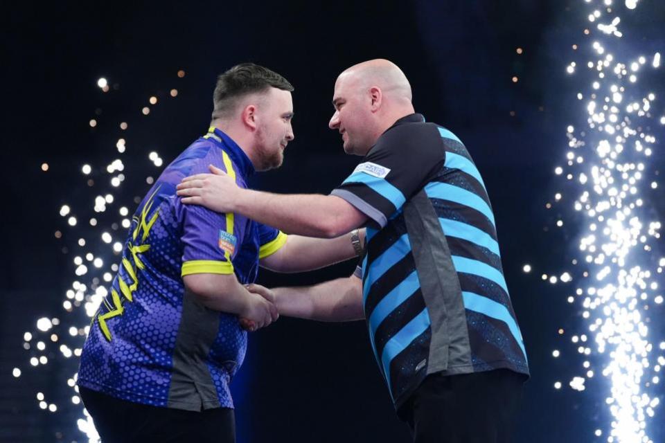 Warrington Guardian: Littler is congratulated by Rob Cross