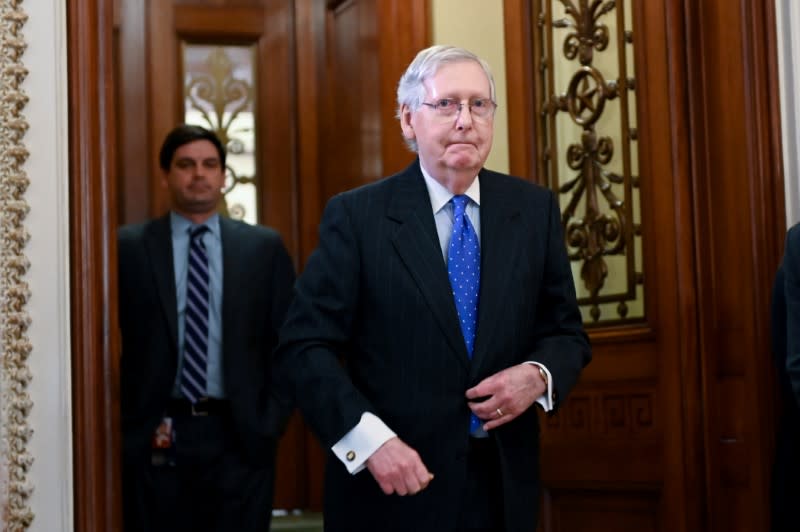 Senate Majority Leader McConnell exits the Senate chamber during a break in the Senate impeachment trial of President Trump