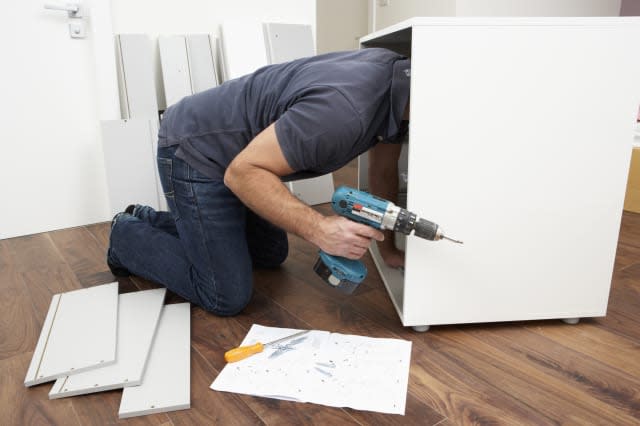 Man Assembling Flat Pack Furniture