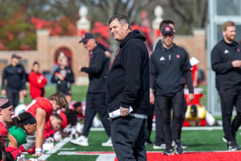 Offensive coordinator Kirk Ciarrocca observes warm up exercises before Rutgers University football spring practice at Marco Battaglia Practice Complex in Piscataway, NJ Tuesday April 11, 2023.