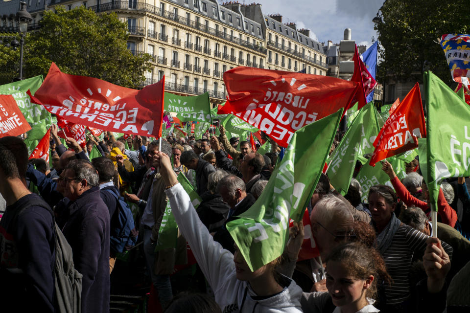 Conservative activists gather to protest in Paris, Sunday Oct. 6, 2019, against a French bill that would give lesbian couples and single women access to in vitro fertilization and related procedures. Traditional Catholic groups and far-right activists organized Sunday's protest, arguing that it deprives children of the right to a father. (AP Photo/Rafael Yaghobzadeh)