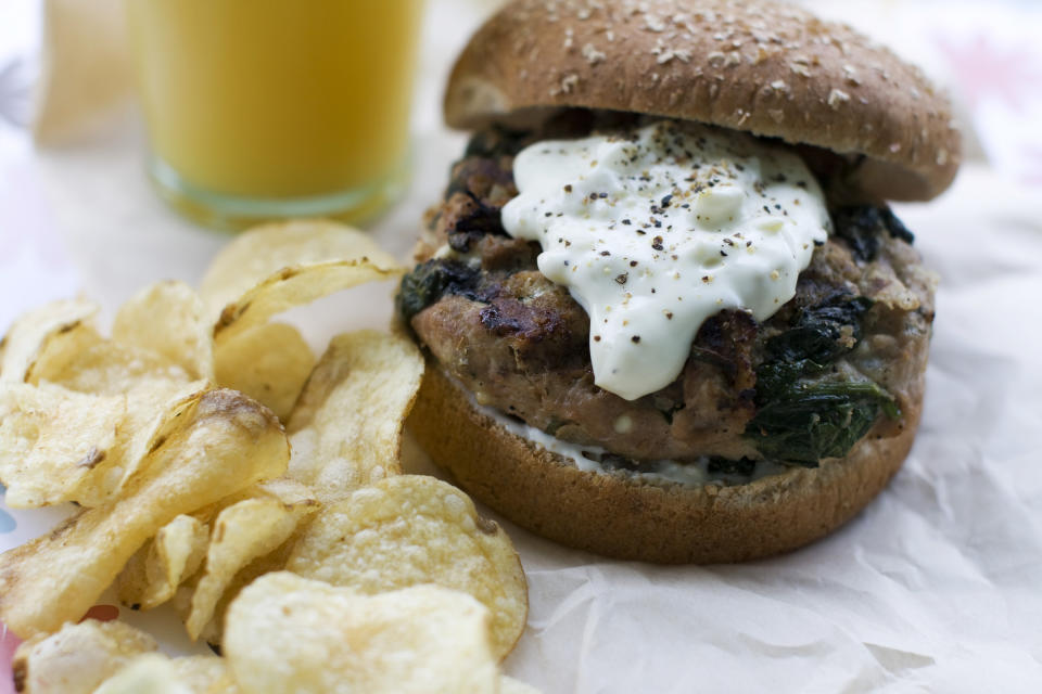 In this image taken on May 20, 2013, a Greek-style turkey burger with pepperoncini sauce is shown in Concord, N.H. (AP Photo/Matthew Mead)