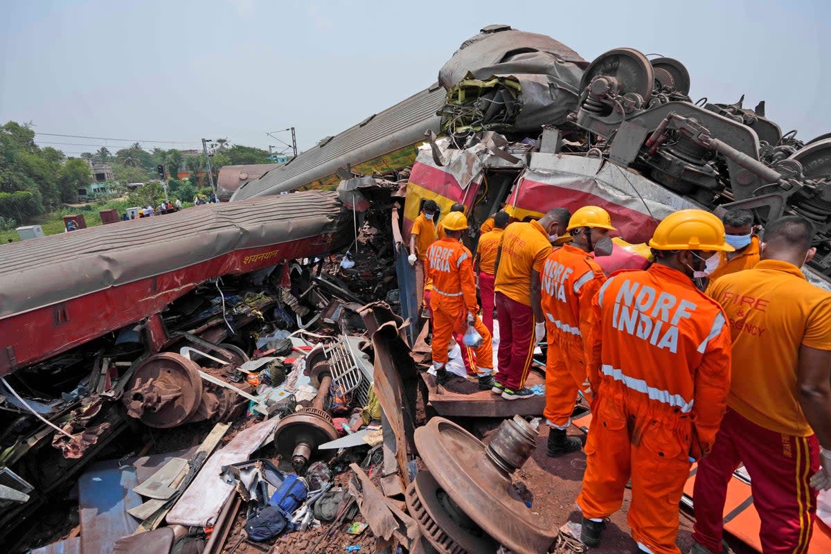 Rescuers work at the site of passenger trains that derailed in Balasore district (Copyright 2023 The Associated Press. All rights reserved)