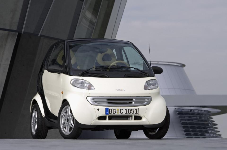 <p>Smart made <strong>slight tweaks</strong> to the shape of the Micro Compact Car concept as it created the City-Coupe but the basic mono-box silhouette stayed roughly the same. The front end got a less robot-like design that incorporated <strong>almond-shaped headlights</strong>. Designers dusted off the Micro Compact Car’s trapezoidal lights when they gave the car a facelift in 2001.</p>