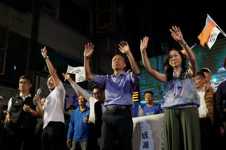 Opposition Nationalist Kuomintang Party (KMT) Kaohsiung mayoral candidate Han Kuo-yu and his wife celebrates after he won in local elections, in Kaohsiung, Taiwan November 24, 2018. REUTERS/Tyrone Siu