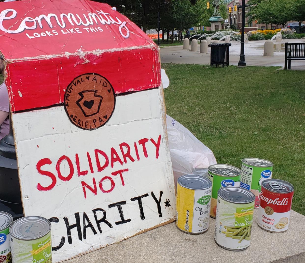 A food drive and protest against former President Donald Trump's campaign took place at Perry Square on Saturday shortly before Trump hosted a campaign rally at Erie Insurance Arena.