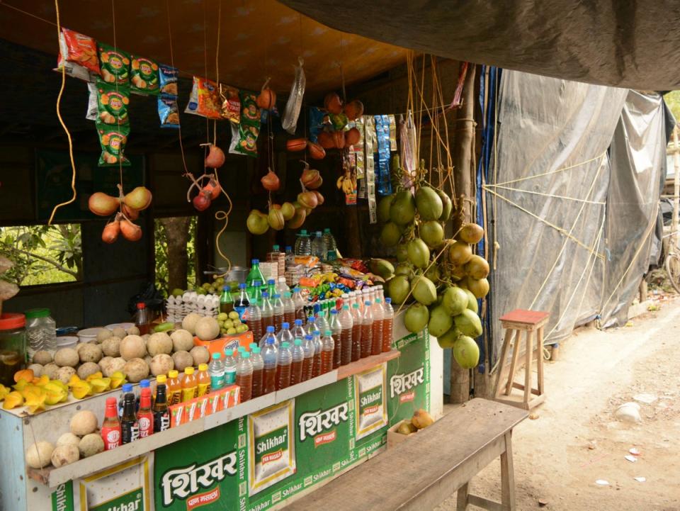 Local produce, including fruits, vegetables and honey being sold at market in Sundarbans Wild Animal Park, Jharkhali (Namita Singh/ The Independent)