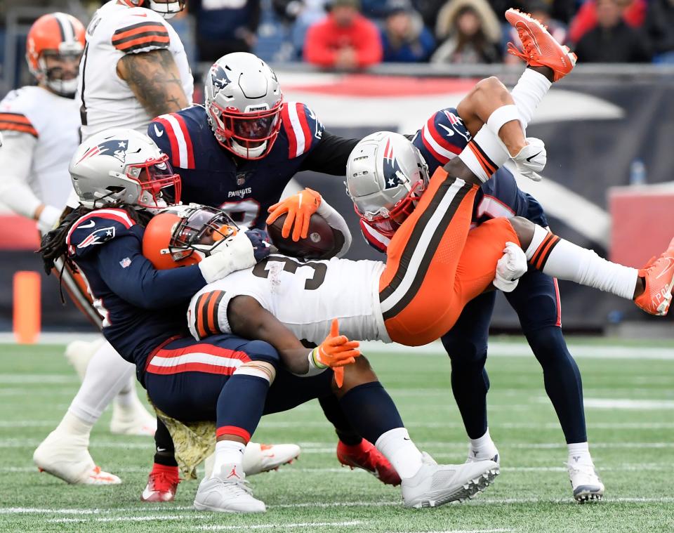 Nov 14, 2021; New England Patriots outside linebacker Dont'a Hightower (54) tackles Cleveland Browns running back D'Ernest Johnson (30) during the second half at Gillette Stadium. Foxborough, Massachusetts, USA.