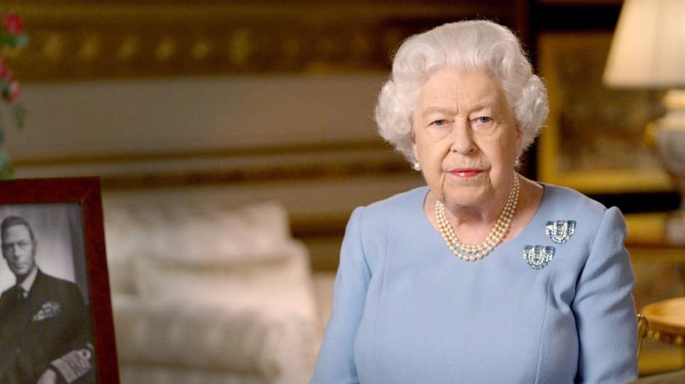 WINDSOR, ENGLAND - MAY 08: NEWS EDITORIAL USE ONLY. NO COMMERCIAL USE (including any use in merchandising, advertising or any other non-editorial use) In this handout provided by Buckingham Palace, Queen Elizabeth II addresses the nation and the Commonwealth on the 75th anniversary of VE Day at Windsor Castle on May 8, 2020 in Windsor, England. (Photo by Buckingham Palace via Getty Images)