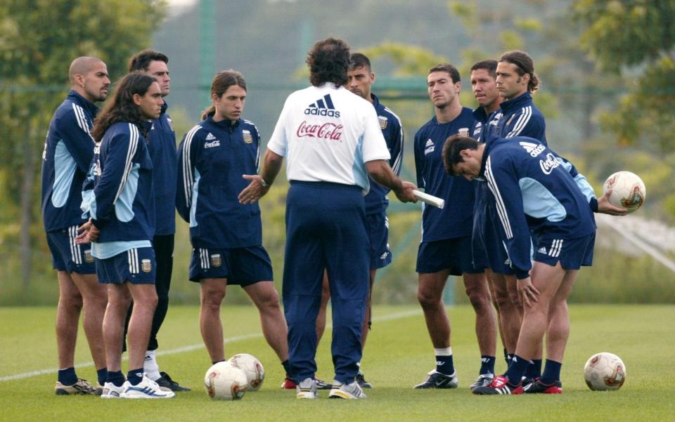 Bielsa's disciples include Diego Simeone and Mauricio Pochettino, pictured here as players under him at the 2002 World Cup with Argentina - AP