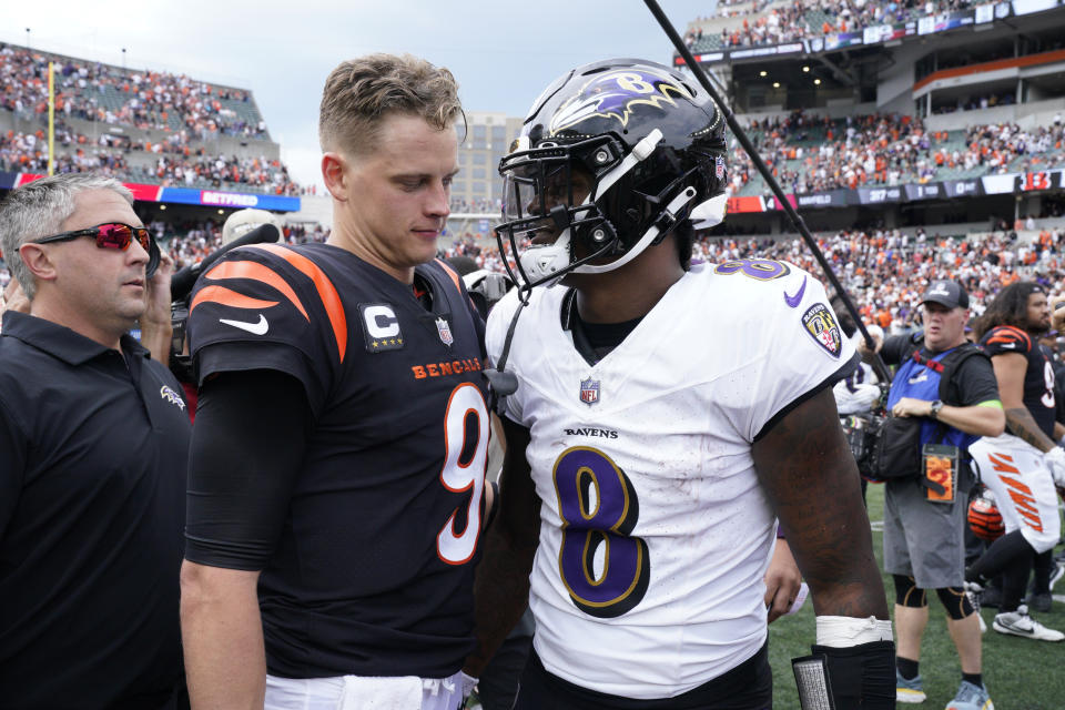 Cincinnati Bengals quarterback Joe Burrow (9) and Baltimore Ravens quarterback Lamar Jackson (8) talk following an NFL football game Sunday, Sept. 17, 2023, in Cincinnati. The Ravens won 27-24. (AP Photo/Jeff Dean)