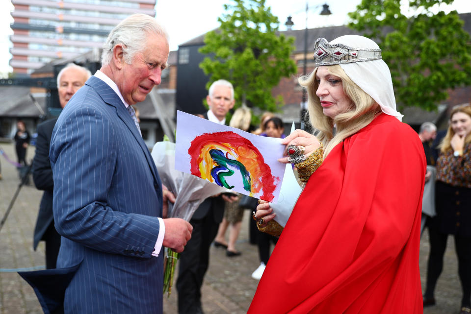 <p>The Prince of Wales meets with Pru Porretta, who is dressed up to represent Lady Godiva, during his visit to the Canal Basin, in Coventry. Picture date: Tuesday May 25, 2021.</p>
