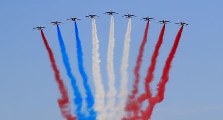 Alpha jets from the French Air Force Patrouille de France fly during the traditional Bastille Day military parade on the Champs-Elysees Avenue in Paris, France, July 14, 2018. REUTERS/Gonzalo Fuentes