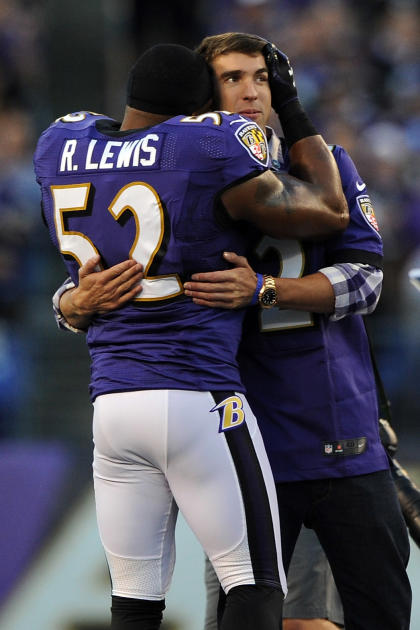 Ray Lewis found time to hug his buddy Michael Phelps before Monday's game. (Getty Images)