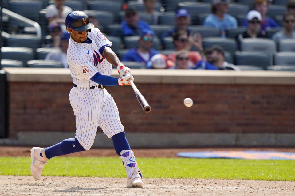 New York Mets' Francisco Lindor hits an eighth-inning double during a baseball game against the Philadelphia Phillies, Sunday, June 27, 2021, in New York. (AP Photo/Kathy Willens)