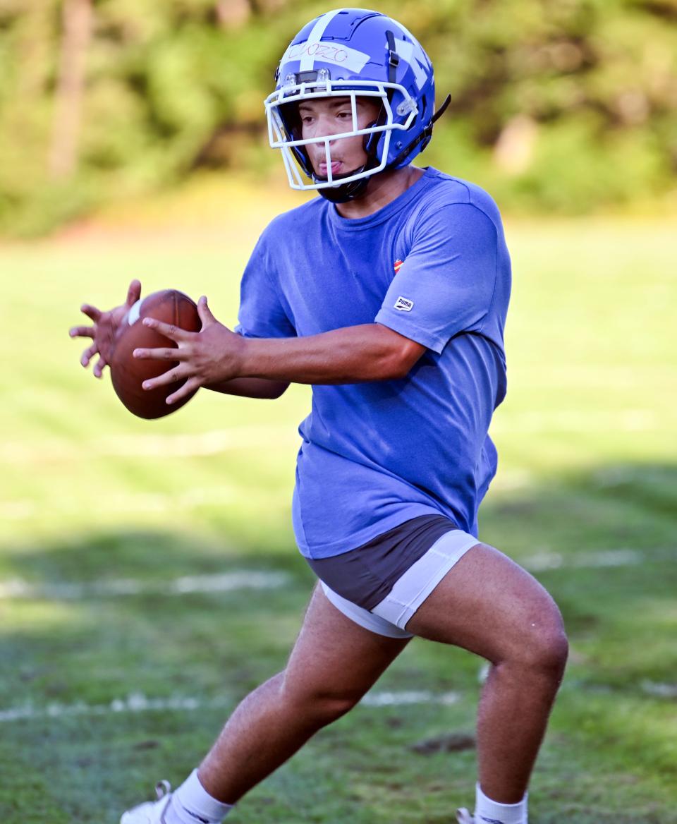 MASHPEE  8/19/22  Mashpee runningback Aidan Cuozzo takes a pitch out in practice Friday.  football