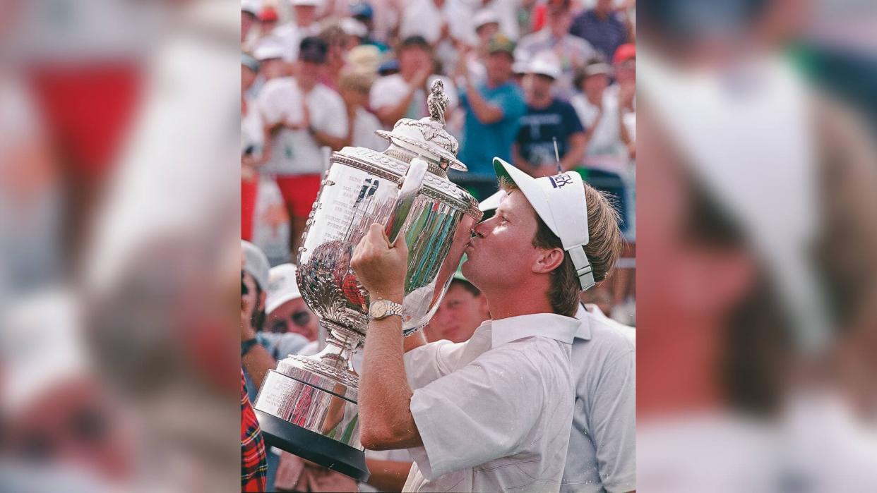 Sluman Jeff Sluman kisses his trophy cup after winning the PGA golf championship at Oak Tree Club in Edmond, Okla.