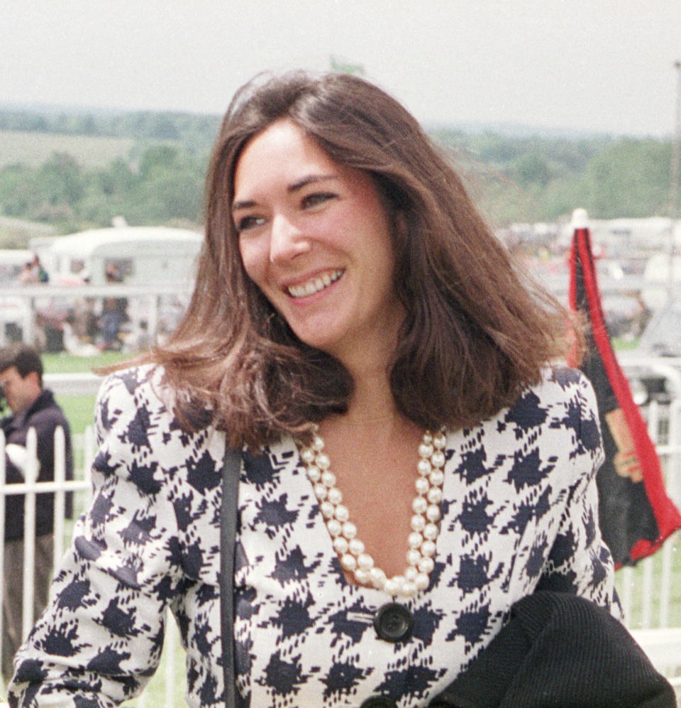 FILE - In this June 5, 1991 file photo, British socialite Ghislaine Maxwell arrives at Epsom Racecourse. Jeffrey Epstein’s former girlfriend will face a judge and at least one of her accusers by video at a hearing to determine whether she stays behind bars until trial on charges she recruited girls for the financier to sexually abuse a quarter-century before he killed himself in a Manhattan jail. The hearing Tuesday, July 14, 2020, in Manhattan federal court was expected to feature a not guilty plea by Maxwell along with arguments over whether she'll flee if she's released. (Chris Ison/PA via AP, File)