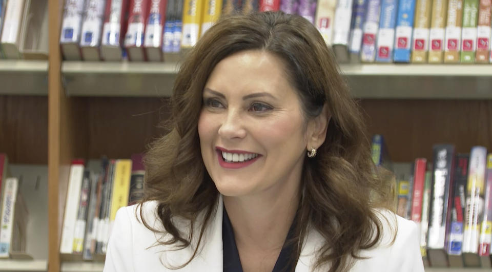 In this image made from video, Michigan Gov. Gretchen Whitmer speaks with educators, parents and students during a back-to-school event at Novi High School on Wednesday, Aug. 24, 2022, in Novi, Mich. A day earlier, two men were convicted of conspiring to kidnap Whitmer. (AP Photo/Mike Householder)