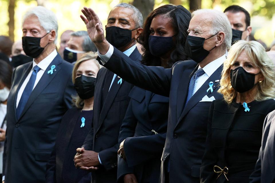 President Joe Biden (C) waves as he is joined by (L-R) former President Bill Clinton, former First Lady Hillary Clinton, former President Barack Obama, former First Lady Michelle Obama, First Lady Jill Biden and former New York City Mayor Michael Bloomberg, during the annual 9/11 Commemoration Ceremony at the National 9/11 Memorial and Museum on September 11, 2021 in New York.