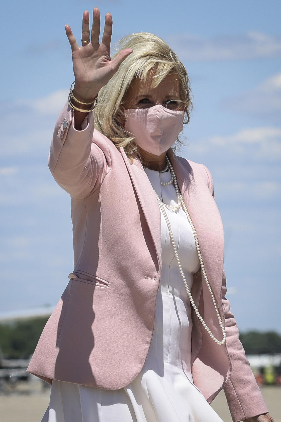 First lady Jill Biden waves as she walks to board an aircraft at Andrews Air Force Base, Md., Thursday, May 13, 2021. Biden is traveling to West Virginia. (Oliver Contreras/The New York Times via AP, Pool)