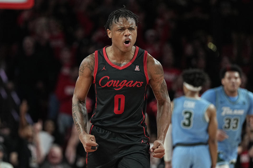 Houston guard Marcus Sasser (0) celebrates after hitting a 3-pointer during the first half of an NCAA college basketball game against Tulane, Wednesday, Feb. 22, 2023, in Houston. (AP Photo/Kevin M. Cox)