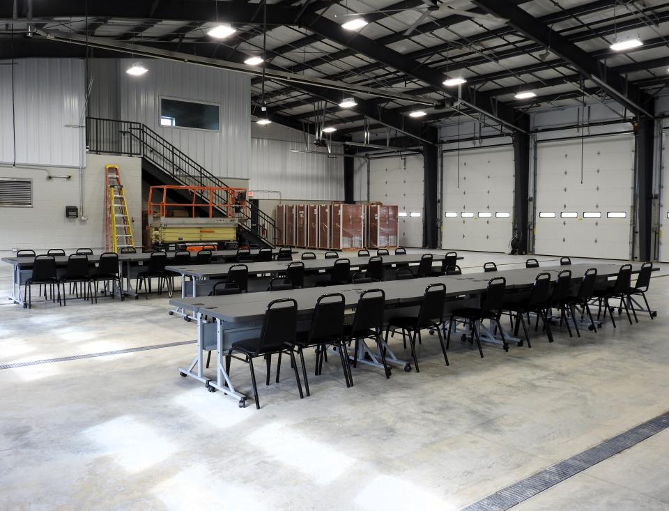 The garage of the new Coshocton County Emergency Medical Services building has five bays with 14-foot doors. It will house four ambulances and four SUVs. Tables were setup in the area for a recently meeting of the Coshocton Rotary Club, which took a tour of the new facility.