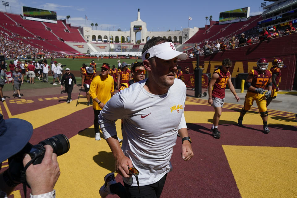 Southern California head coach Lincoln Riley runs off the field after his team warmed up before an NCAA college football game against Rice in Los Angeles, Saturday, Sept. 3, 2022. (AP Photo/Ashley Landis)