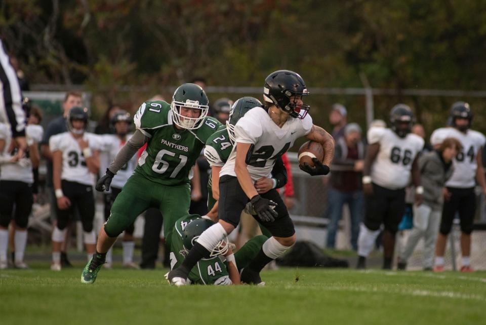 Marshall senior Jesse Saldana runs the ball during a game at Pennfield High School on Friday, Sept. 23, 2022.